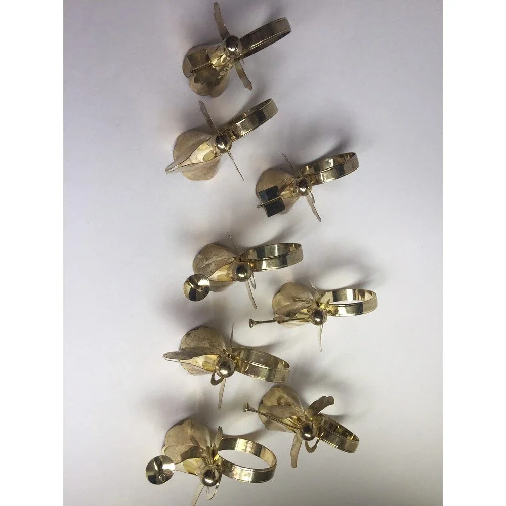 Set of 8 vintage napkin rings trumpet singing drums and candle